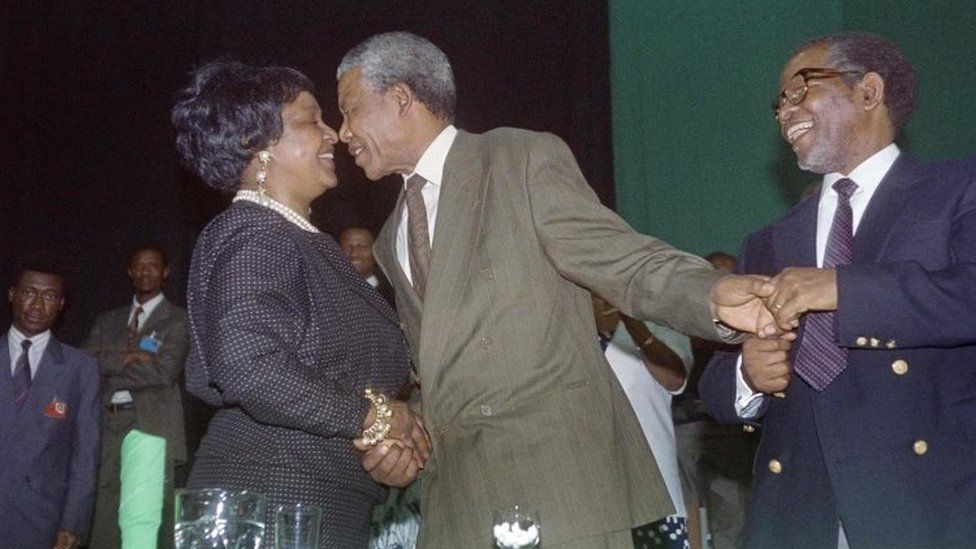 Nelson Mandela and Winnie Madikizela-Mandela kiss after his victory as head of ANC