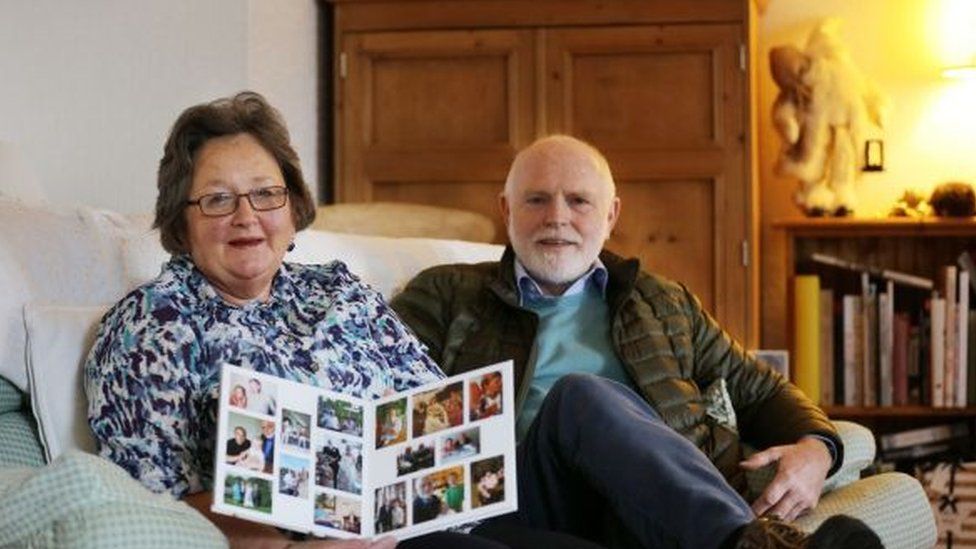 Stephanie McCorkell and her husband, Charles, looking at family photos