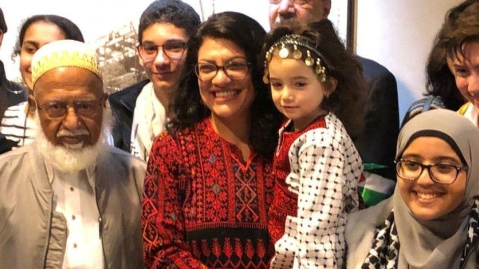 Ms Tlaib poses with supporters on her first day in Washington