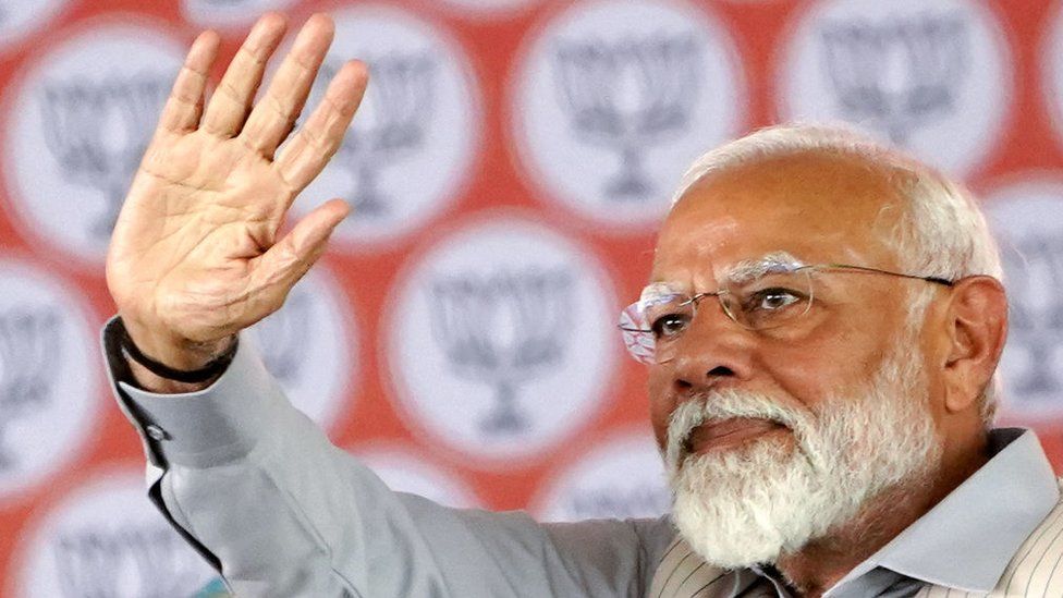 India's Prime Minister Narendra Modi greets his supporters during an election campaign rally in Pushkar on April 6, 2024, ahead of the country's upcoming general elections. (Photo by HIMANSHU SHARMA / AFP) (Photo by HIMANSHU SHARMA/AFP via Getty Images)