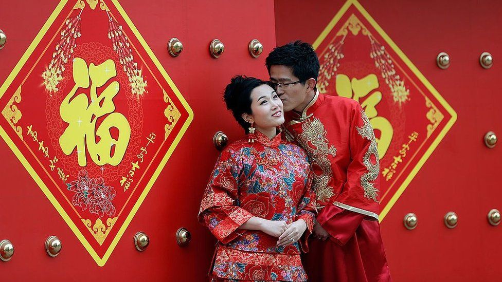 A couple dressed in traditional Chinese costumes have wedding portraits made on Valentine's Day 14 February 2013 in Beijing, China.