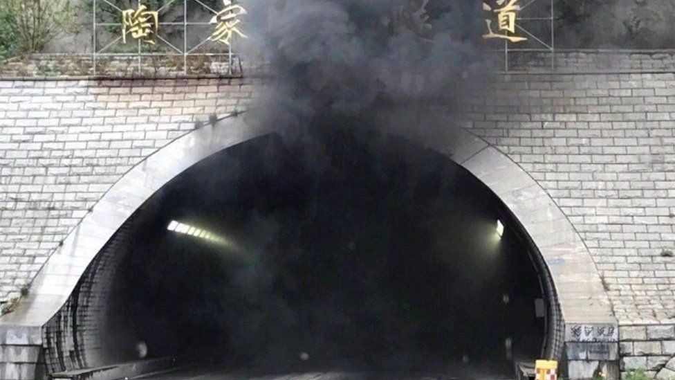 Smoke pouring from the tunnel in Weihai, Shandong province. 9 May 2017