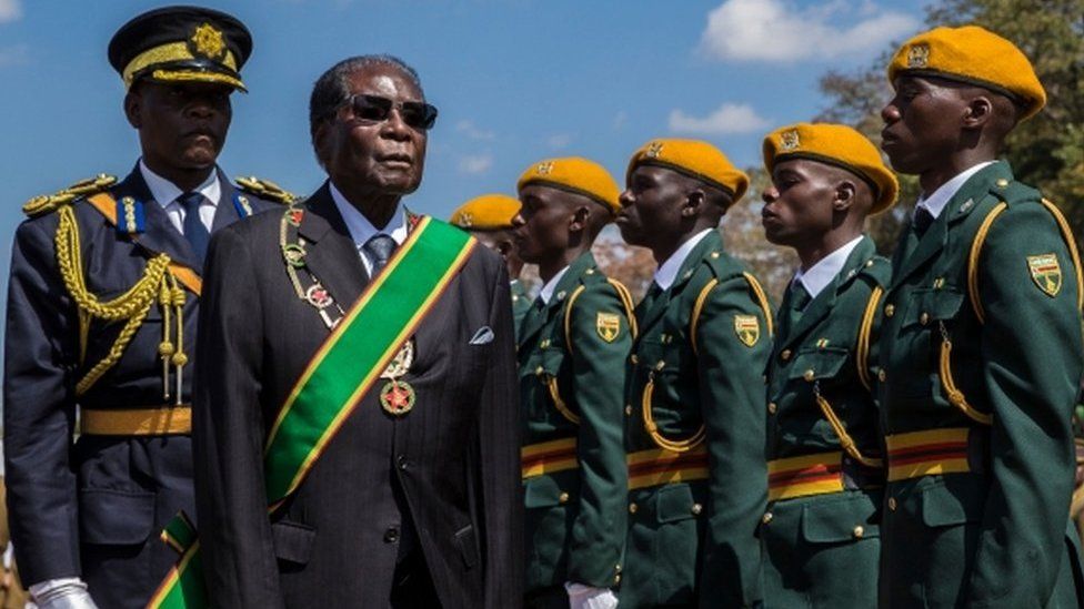 Zimbabwe's President Robert Mugabe inspects a guard of honour on 14 August, 2017.