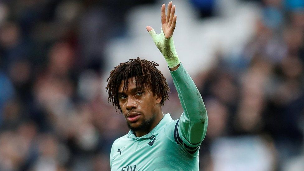 Arsenal's Alex Iwobi gestures to fans after a match in January 2019