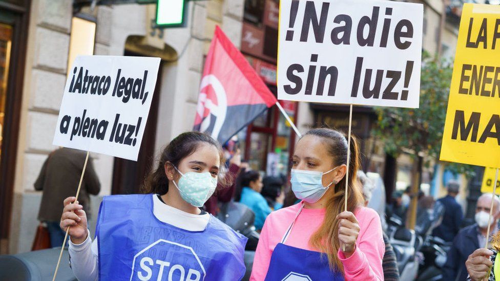 Protesters hold placards during the demonstration. People held a protest against the increase of electricity prices in Madrid