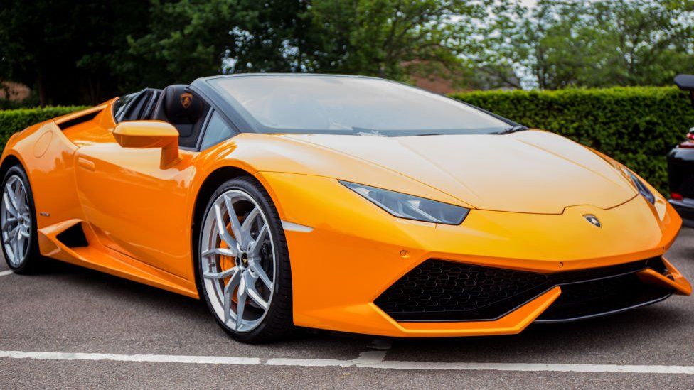 A bright orange Lamborghini Huracán
