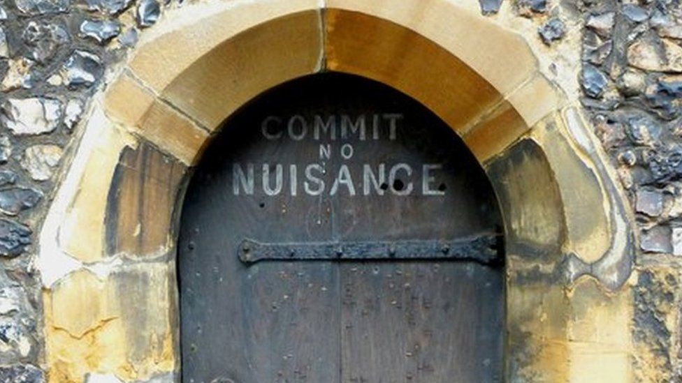A door that says Commit No Nuisance on the St Albans Clock Tower