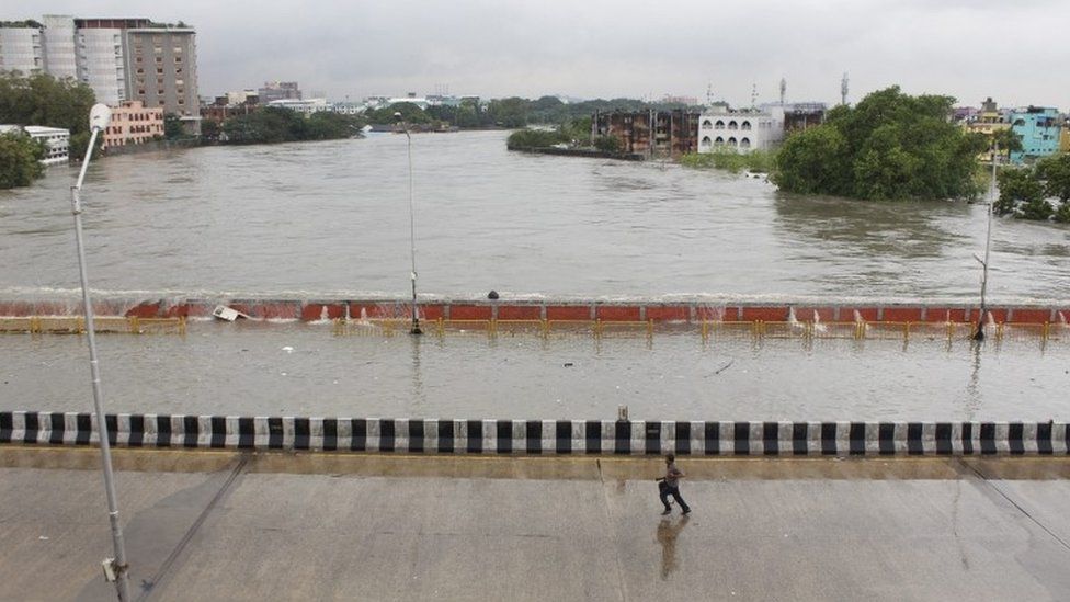 A bridge is submerged in flood waters in Chennai, India, 02 December 2015.