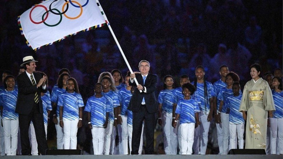 Thomas Bach waved the Olympic flag during the closing ceremony of the Rio Olympics, 22 Aug 16