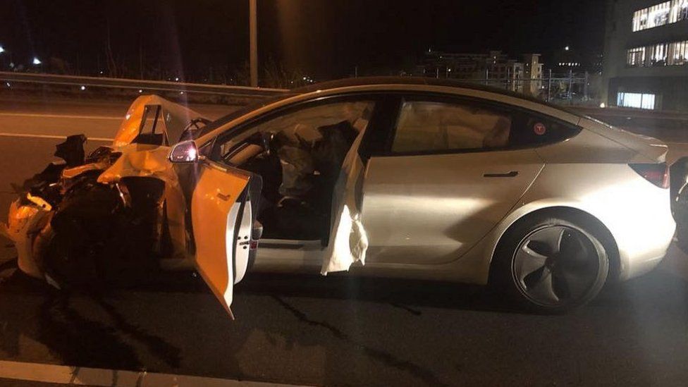 A Tesla Model 3 following a crash with a police car.