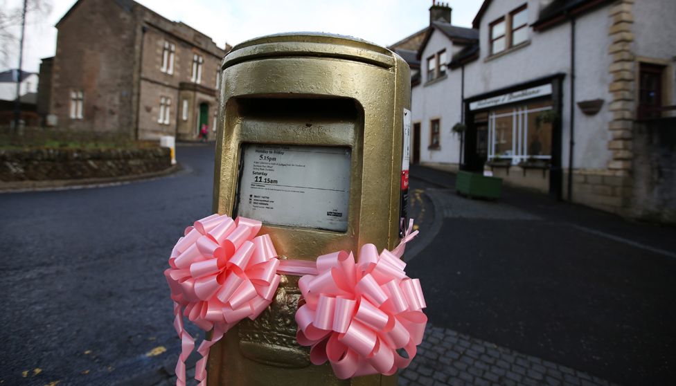 The gold post box in Andy Murray's home town of Dunblane is decorated
