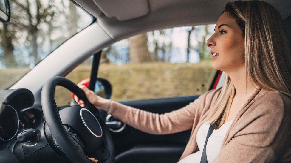 A woman driving a car