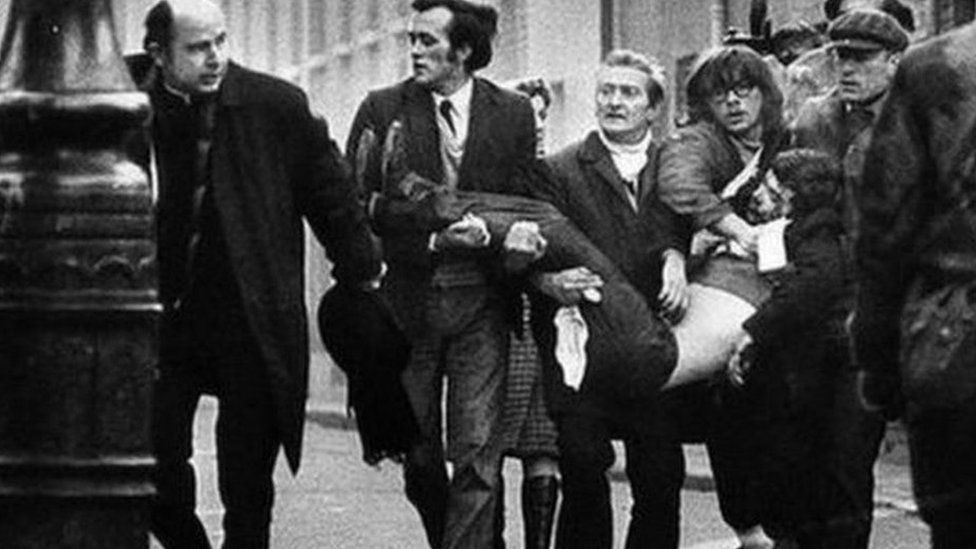 A victim of Bloody Sunday is carried through the streets of Derry