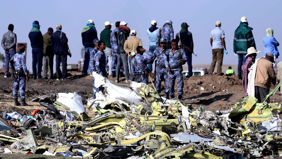 Ethiopian Federal policemen stand at the scene of the Ethiopian Airlines Flight ET 302 plane crash on 11th March 2019