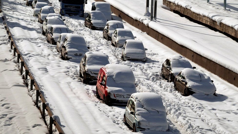 Cars in the Greek capital covered in snow