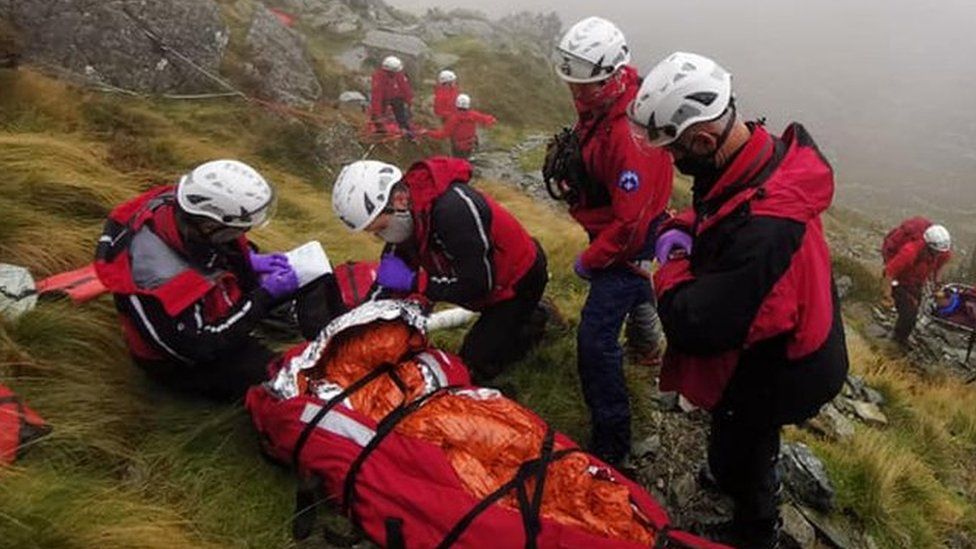 Sunday: Rescuers help a man seriously injured after falling on Tryfan