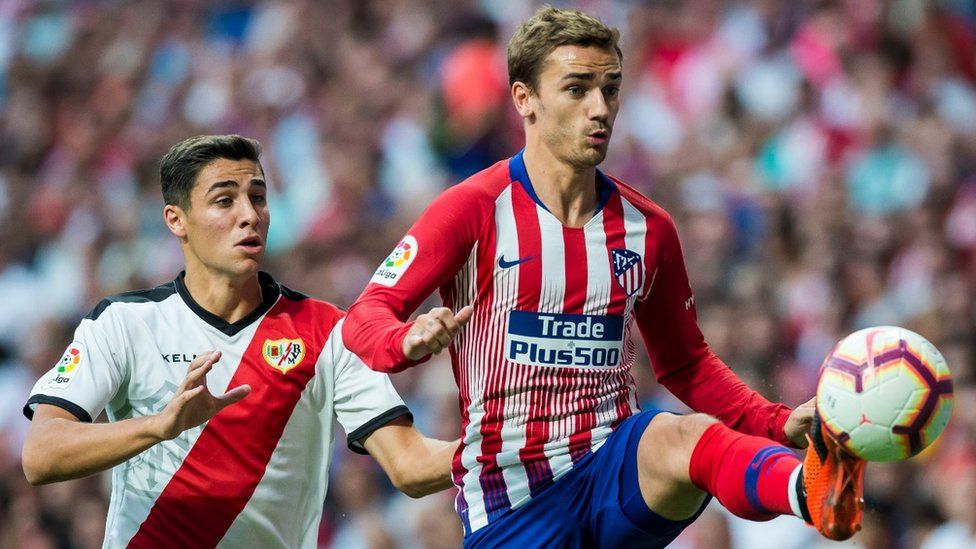 Antoine Griezmann of Atletico de Madrid fights for the ball against Rayo Vallecano