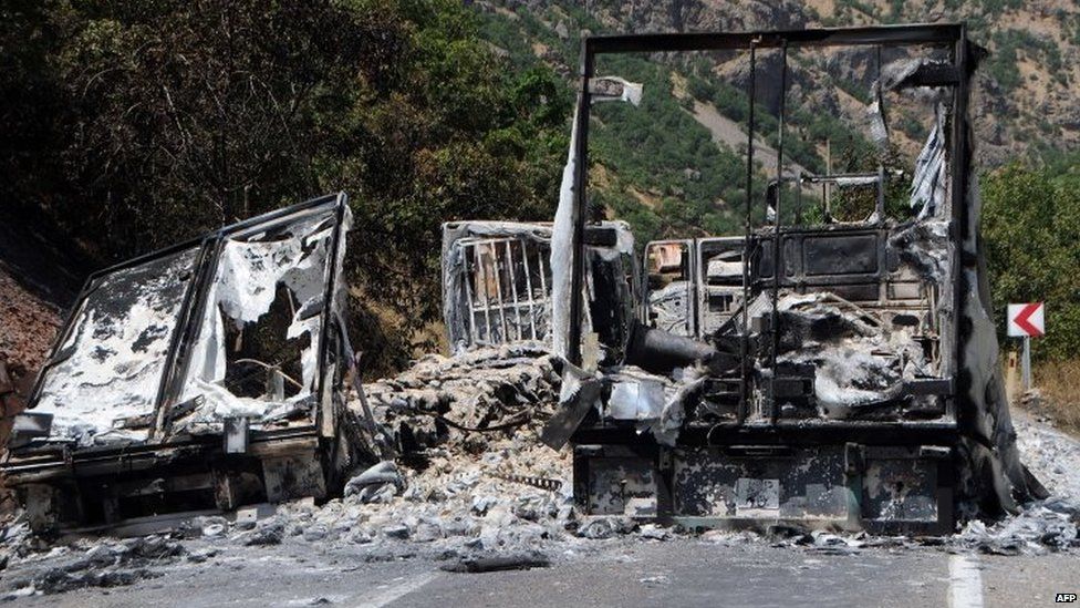 Burnt trucks on a main road to Tunceli, eastern Turkey 02/08/2015