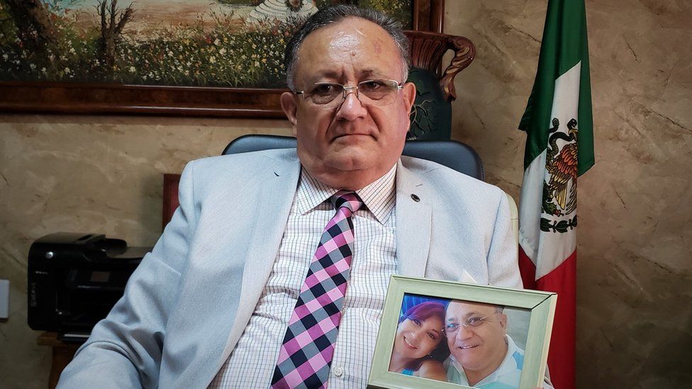 Octavio Cotero holds a photo of his missing daughter
