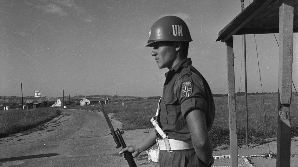 A United Nations Emergency Force officer manning a checkpoint on the border between Gaza and Israel, 1966