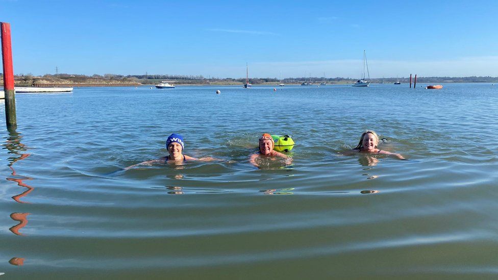 three manningtree mermaids swimming