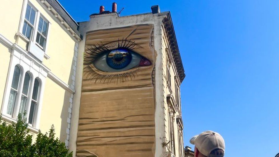 An eye mural on a building
