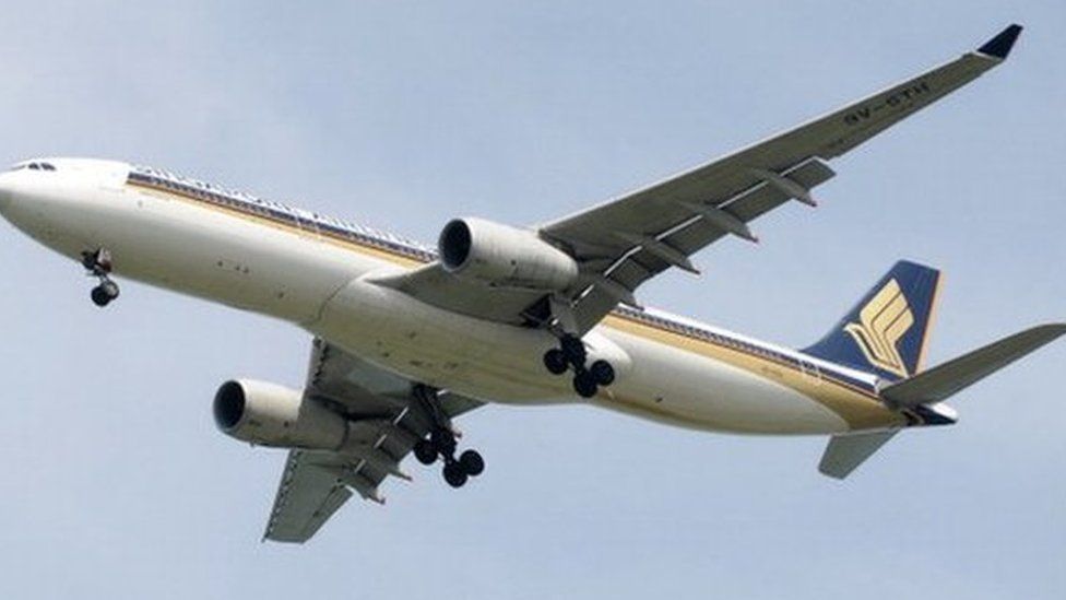 This photograph taken on 4 May 2014 shows a Singapore Airlines (SIA) aircraft approaching Changi International Airport in Singapore