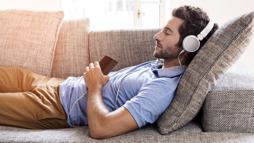 A man listening to a podcast