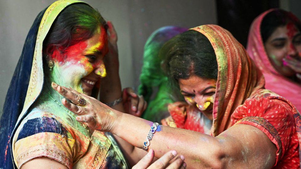 Two women celebrate in southern India's Hyderabad city