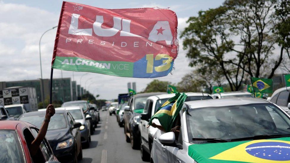 A supporter of Brazil's former President and candidate for presidential election Luiz Inacio Lula da Silva gestures during a motorcade to support Brazilian President Jair Bolsonaro, in Brasilia, Brazil October 1, 2022