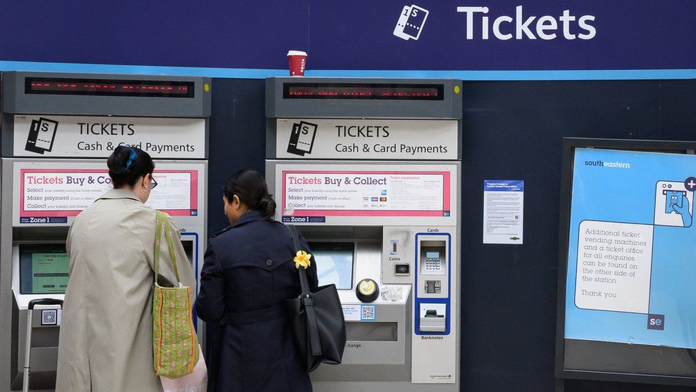 Customers collect tickets from ticket vending machines