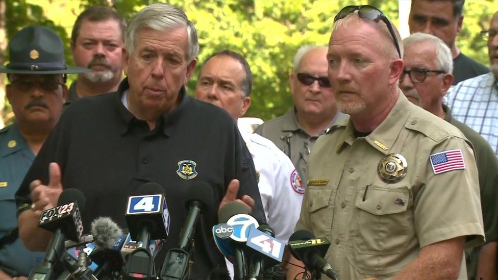 Missouri governor Mike Parson and Stone County Sheriff Doug Rader speaking with reporters on Friday