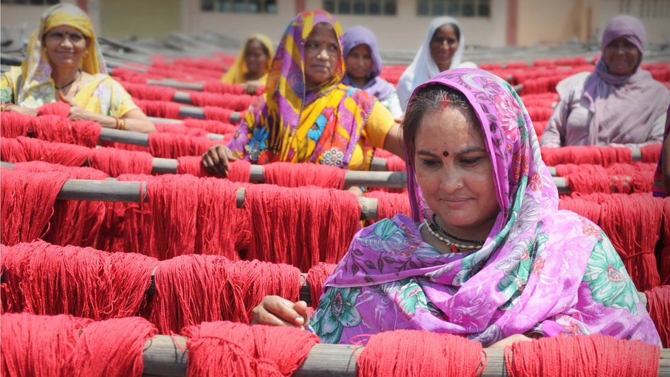 Women working on dyed wool