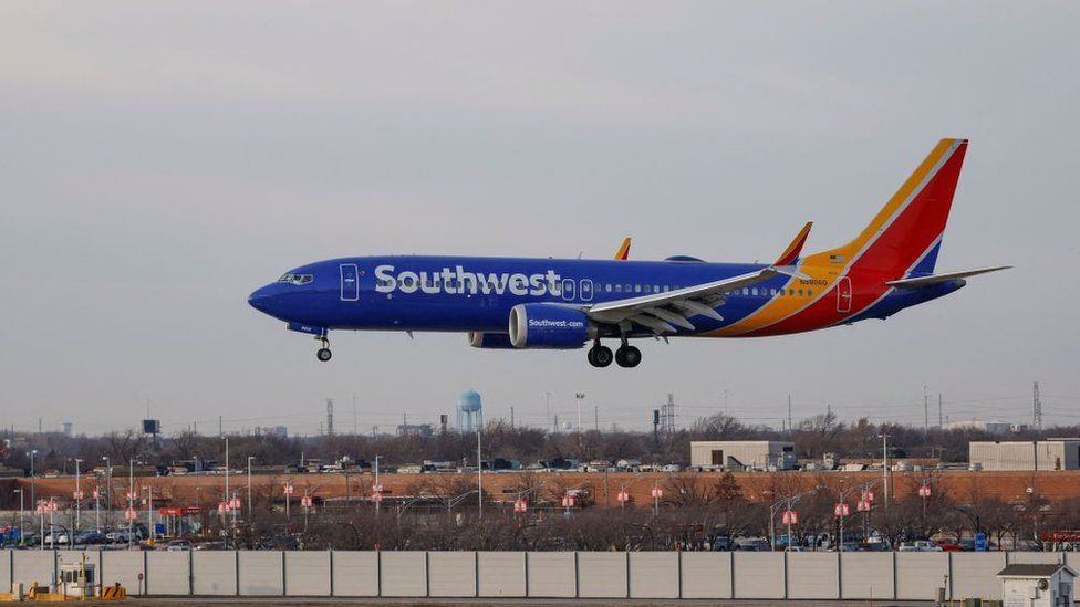 A Southwest plane lands at a Chicago airport in December