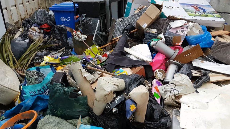 A pile of illegally-dumped rubbish in Denbighshire
