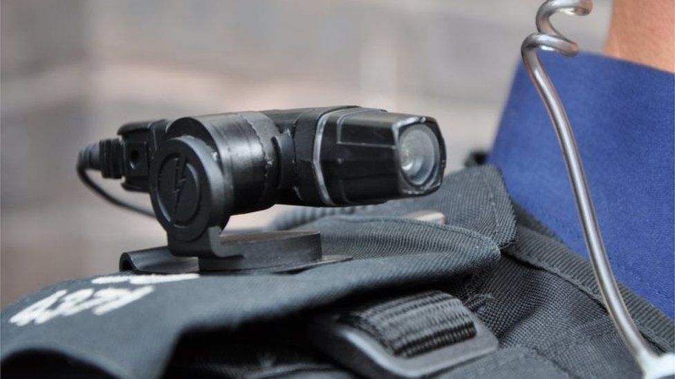 Close up of British Police officer wearing a shoulder mounted camera