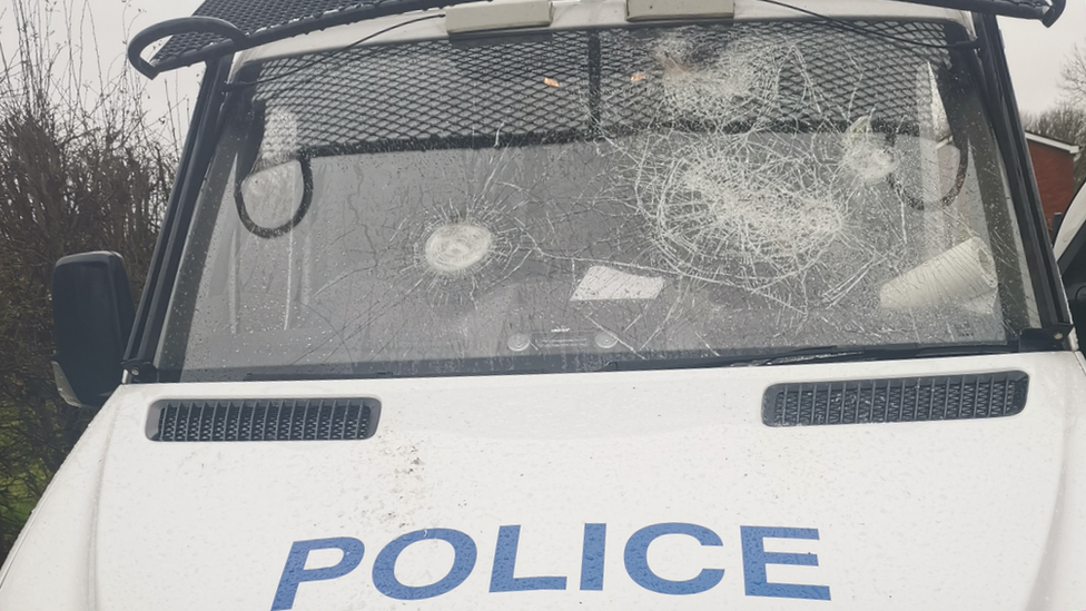 shattered windscreen on police van