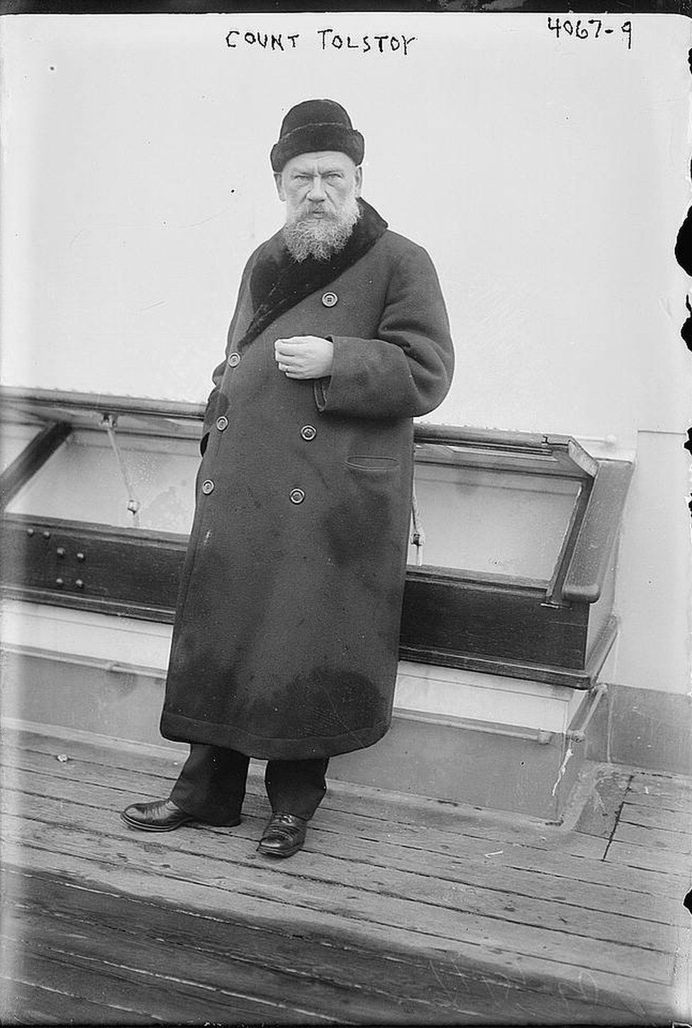 Count Tolstoy stands on board the deck