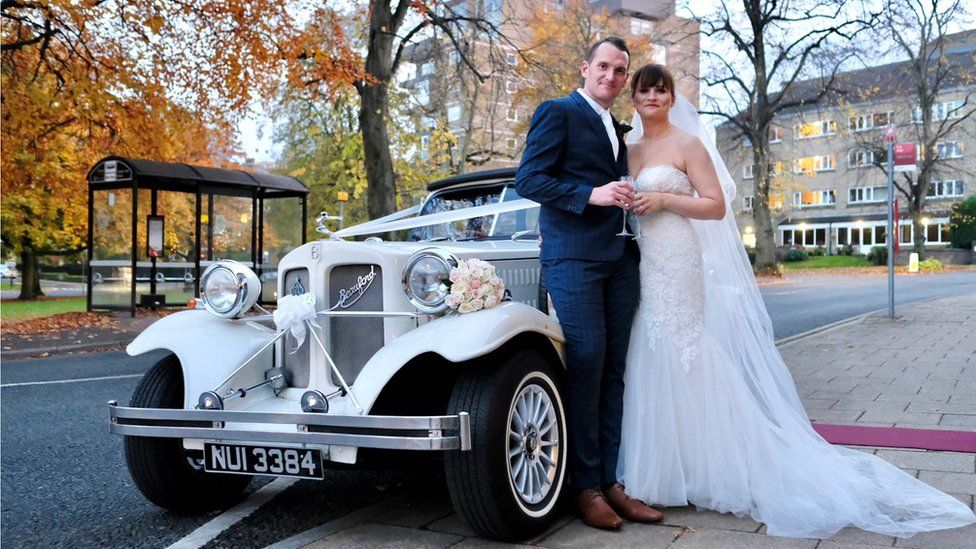 Craig and Kirsty Williams next to a vintage car