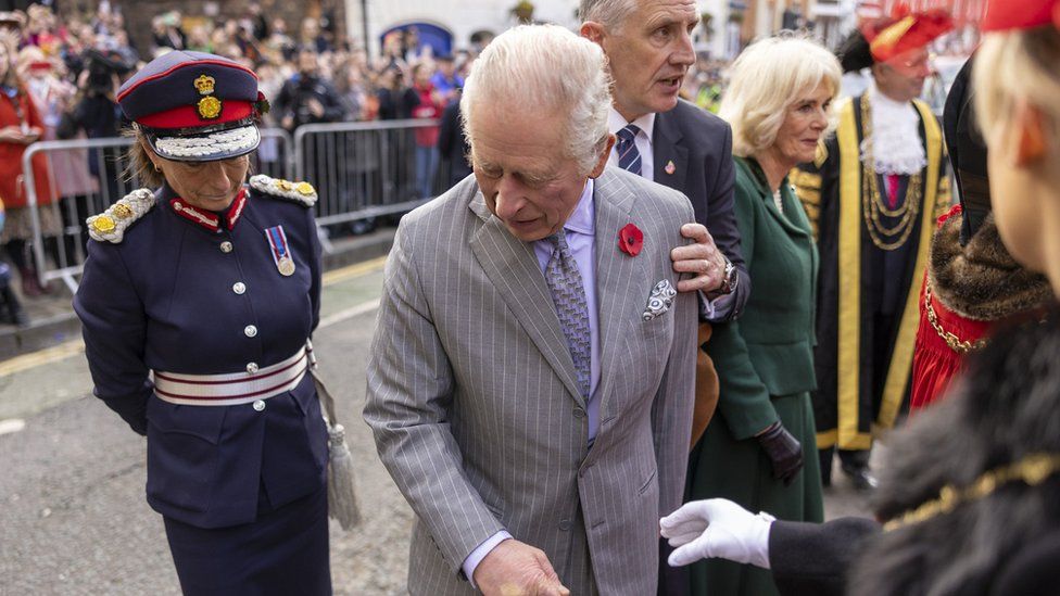 King Charles III reacts after an egg was thrown his direction as he arrived for a ceremony at Micklegate Bar in York
