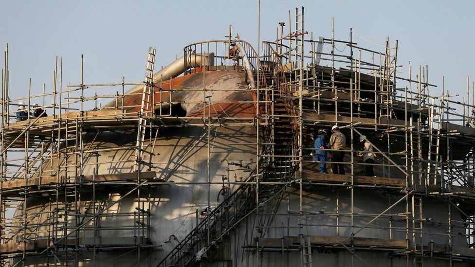 File photo showing workers inspecting damage at the Abqaiq oil facility in Saudi Arabia (20 September 2019)