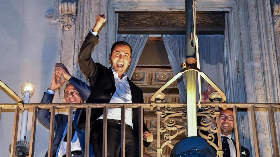 Italian Deputy Prime Minister Luigi Di Maio celebrates on a balcony of Chigi Palace on 27 September