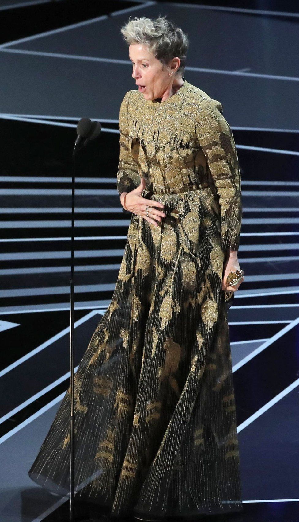 Frances McDormand onstage with her Oscar