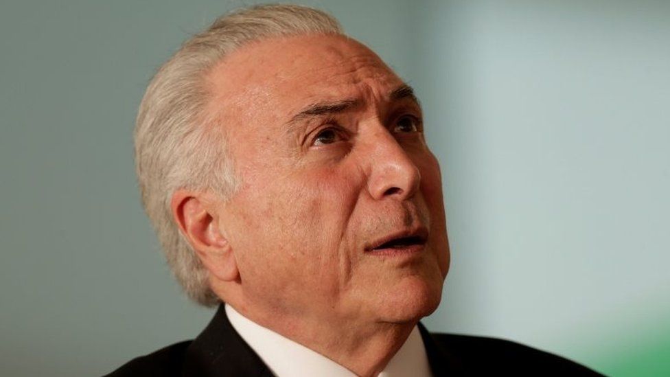 Brazil"s President Michel Temer reacts during a presentation ceremony for the Order of Medical Merit in Brasilia, Brazil, March 27, 2018.