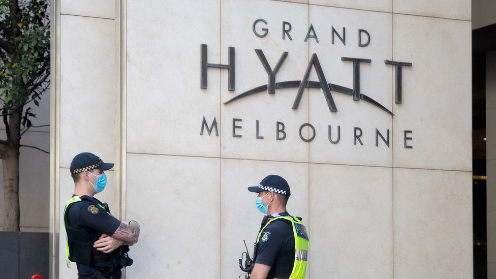 Police guard quarantining tennis players inside the Grand Hyatt Melbourne in Australia