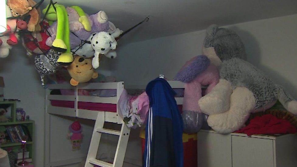A set of bunk beds and stuffed toys