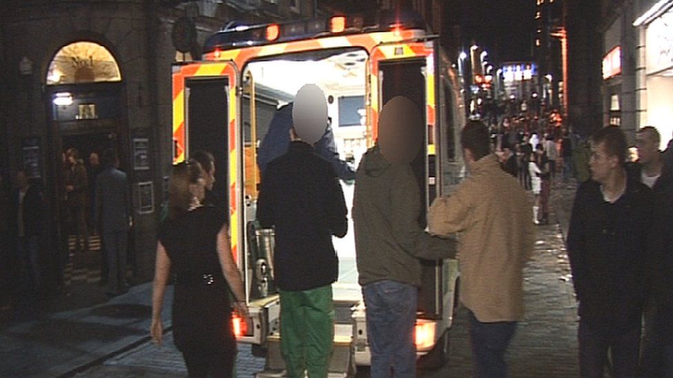 Patient being helped onto ambulance