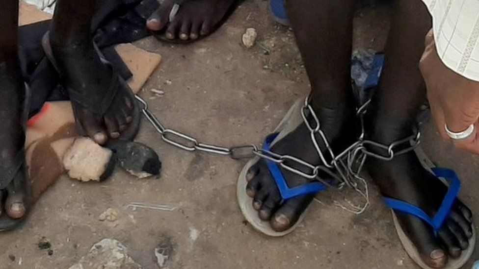 People with chained legs are pictured after being rescued by police in Sabon Garin, in Daura local government area of Katsina state, Nigeria October 14