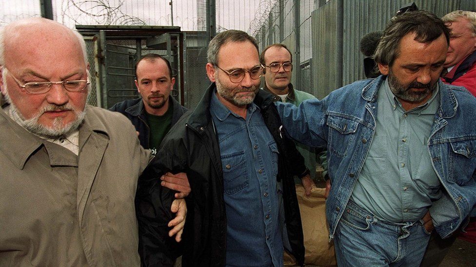 Brighton bomber Patrick Magee (centre), who tried to kill Margaret Thatcher in the 1984 bombing of the Grand Hotel in Brighton walks out of the Maze prison for the last time aided by Sinn Fein members including Martin Meehan (left). Magee who was given 8 life sentences for his part in the bomb was released as part of the British Government's early release scheme as part of the Good Friday Agreement.