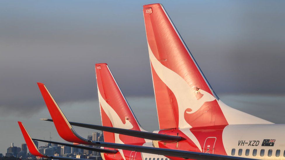 Two Qantas aircraft sit idle on the tarmac at Kingsford Smith Airport, Sydney.